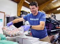 A McKesson worker packing boxes